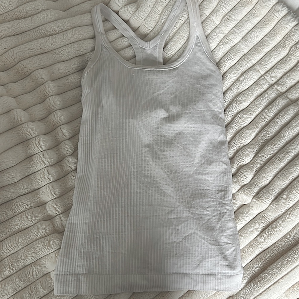 Tag got ripped off, worn quite a few times, great for summer,